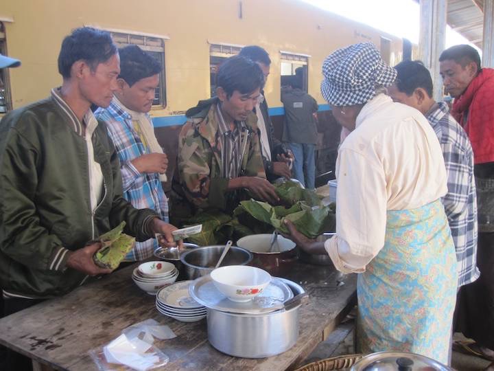 Passengers organising lunch at a station, often wrapped in banana leaf.